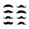 Set of Paper Mustaches. Black silhouette of moustaches. Fathers day decorative element. isolated vector