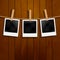Set of photo frames on the rope with clothespin. Polaroid photo frames set on wooden background