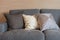 set of pillows on dark color elegance sofa