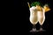 Set of Pina Colada with pineapple, coconut and creamy white top presented in a chilled glass with straw
