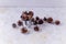 A set of pine cones in silver decorative bucket, isolated on a white background. Cedar cones is a decor and natural food