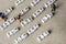 Set of popular crypto coins forming rows made of white cubes with black capital letters and miniature businessmen figurines having