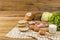 Set products consisting of bread, milk, pork, eggs , and vegetable on wooden table background