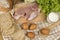 Set products consisting of bread, milk, pork, eggs , and vegetable on wooden table background