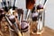 Set of professional brushes on wooden table, closeup