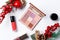 Set of professional elite decorative cosmetics for make-up on a white background with Christmas decorations. The concept of beauty