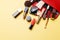 Set of professional elite decorative cosmetics for makeup on a yellow background. The concept of beauty and fashion