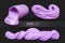 Set of purple realistic slimes on a black background