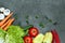 Set of Raw organic vegetables with fresh ingredients for healthily cooking on black  background, top view, banner.