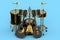 Set of realistic drums with metal cymbals on stand and acoustic guitars on blue
