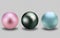 Set of realistic pearls. Round pink, black, blue, formed in the shell of a pearl oyster, a gem. Vector illustration