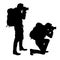 set of realistic vector silhouettes of kneeling and standing photographer with telephoto and backpack, isolated