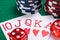 set of red wins in poker on a poker table with chips and dice