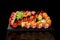 Set of rolls, nigiri sushi and gunkan maki with salmon on black background