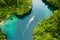 Set sail and discover new worlds of adventure. High angle shot of a boat sailing through a canal running along the Raja