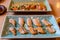 Set of Salmon Burn Aburi Sushi on Crockery Plate