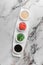 Set of sauces for sushi on a white plate, ginger, soy, sesame, seaweed. bright textured marble background, top view