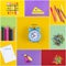 Set of school accessory for learning letter drawing education on background of multicolored paper.