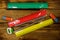 Set of school stationery supplies. Rulers, pencils, erasers and sharpener on wooden desk. Top view