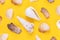 Set of sea shells on yellow background.