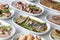 Set of Seafood Dishes. Selective focus marinated anchovy.