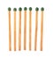 Set of seven green wooden matches on white background