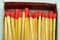 Set of several red-headed matchsticks with one upside down, or without a head.