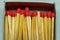 Set of several red-headed matchsticks with one upside down, or without a head.