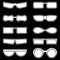 Set of silhouettes of glasses of different shapes. Set of white vector icons. Vector Illustrations on black background.