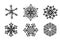 Set of six black silhouette of Christmas snowflakes isolated on white background.