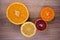 Set of sliced citrus fruits lemon , orange, grapefruit, tangerine over wooden background. Top view.