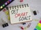 Set smart goals symbol. Concept words Set smart goals on white notebook. Beautiful wooden background. Business and Set smart goals