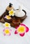 Set of spa treatments, natural oil, and plumeria flowers