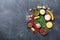 Set of spices and herbs on black stone table top view. Ingredients for cooking. Food background.