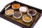 Set of spices and seeds of legumes in glass molds on tray