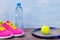 Set of sports items for playing tennis in a form of background