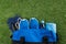 Set of sports things for fitness in a blue bag on a green lawn