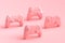 Set of standing gamer joysticks or gamepads on pink background