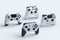 Set of standing gamer joysticks or gamepads on white background