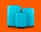 Set of stylish blue plastic suitcases for travel on orange background.