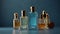 set of stylish perfumes with a unique aroma in a glass bottle on a blue background