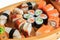 Set of sushi rolls on a wooden ship. Creative serving dishes