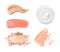Set with swatches of lipsticks, eye shadows and skin foundations on white background