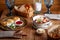 set table with beautiful healthy breakfast cheese pancakes porridge with fruits coffee