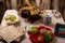 A set table for the Passover Seder with traditional matzah, wine, maror and a hot cholent for the meal and menorah.