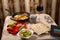 A set table for the Passover Seder with traditional matzah, wine, maror and shakshuka in a frying pan.