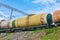 Set of tanks with oil and fuel transport by rail. Railroad Cargo train