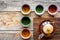 Set for tea ceremony. Glass teapot and ceramic cups on rustic wooden background top view copyspace