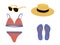 A set of things for the beach: sunglasses, straw hat, swimsuit, flip-flops. outfit for summer holidays.