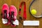 Set of things for playing tennis on a wooden
